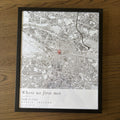 Personalised Dublin map poster in a black frame, flat on a wooden table
