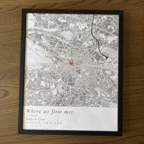 Personalised Dublin map poster in a black frame, flat on a wooden table