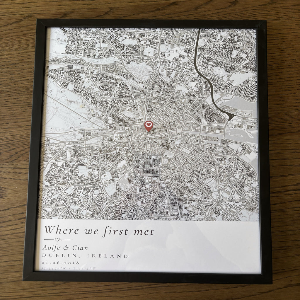 Framed personalised map poster photographed from above